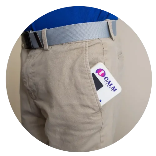 CALM PEMF device in blue fanny pack worn on waistband