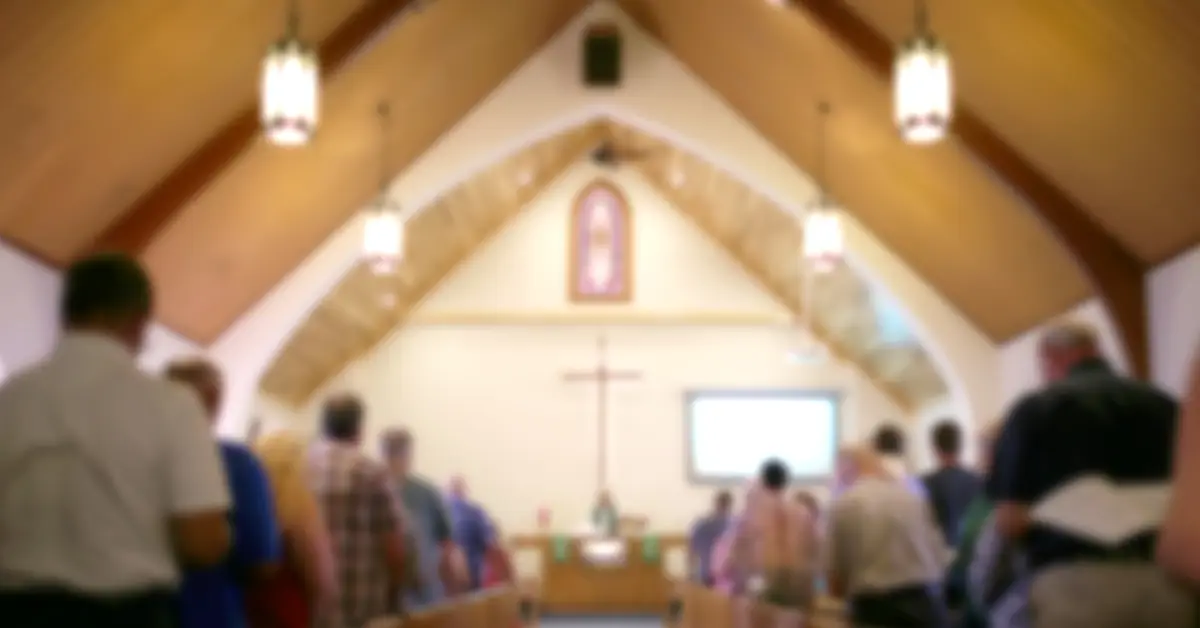 Church interior with cross during service or gathering