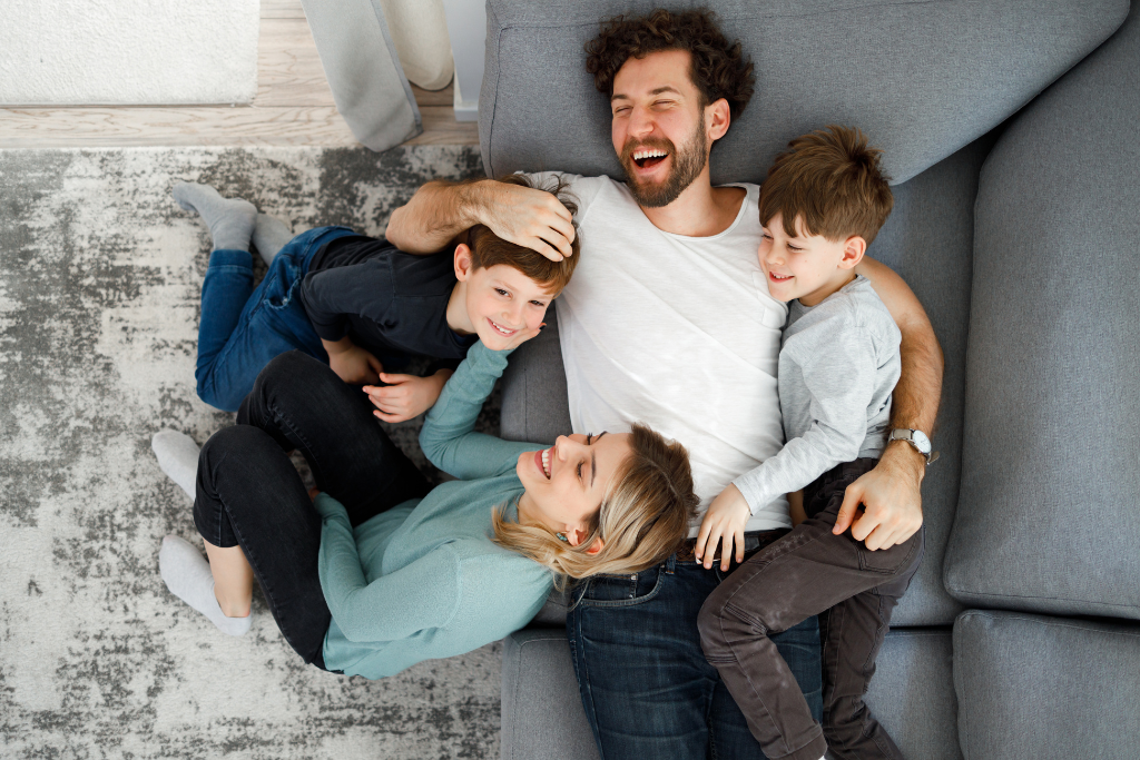 Father and children playing and laughing together