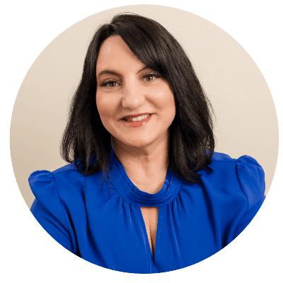 Professional headshot of Dr. Roseann Capanna-Hodge in blue shirt