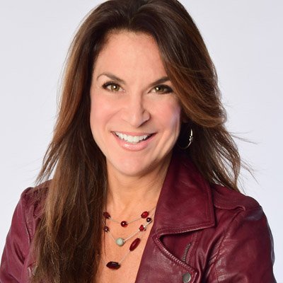 Woman with dark hair wearing burgundy jacket, professional headshot