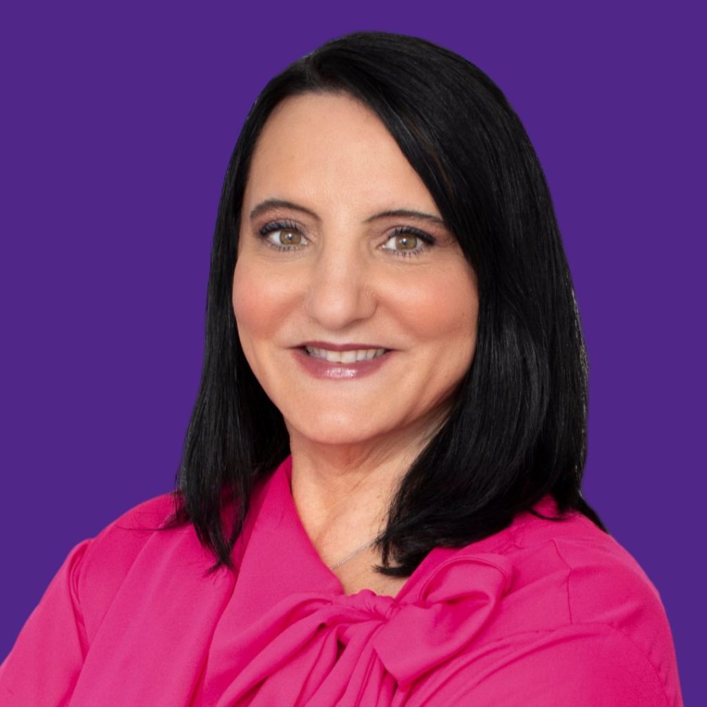 Dr. Roseann Capanna-Hodge professional headshot against purple background