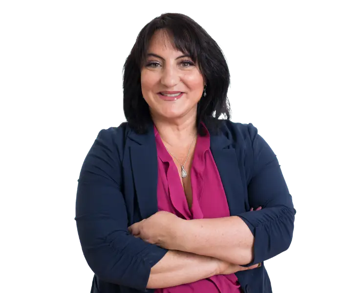 Professional headshot of woman in white blazer over magenta blouse