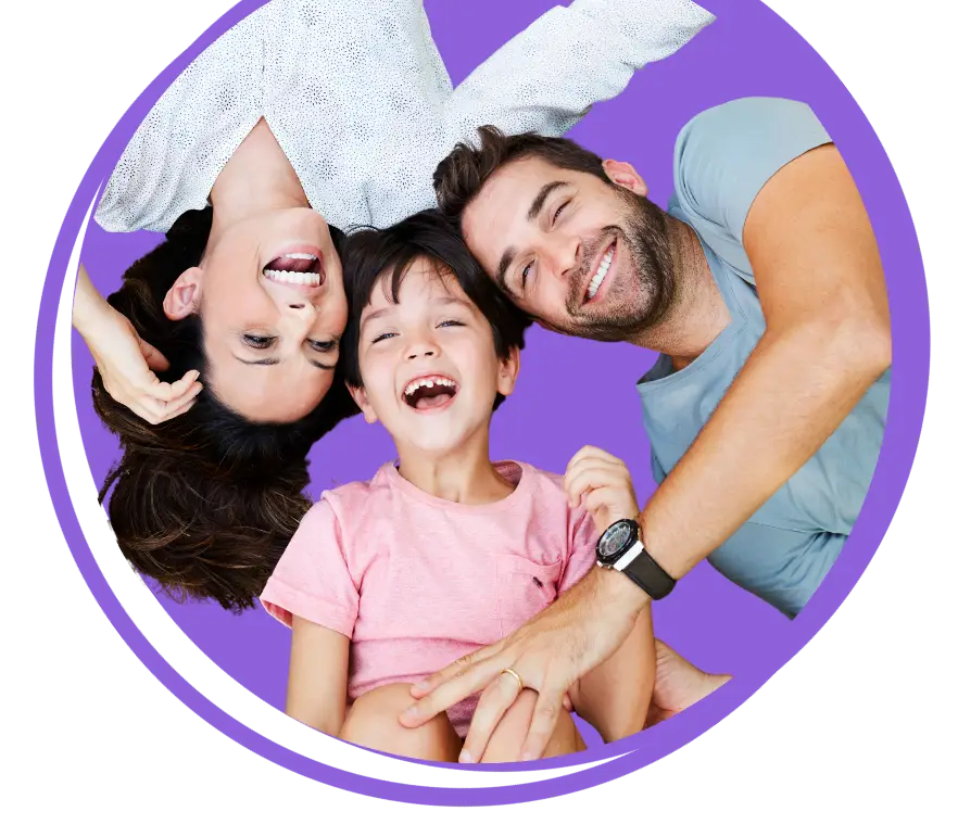 Family portrait with two parents and two children smiling together