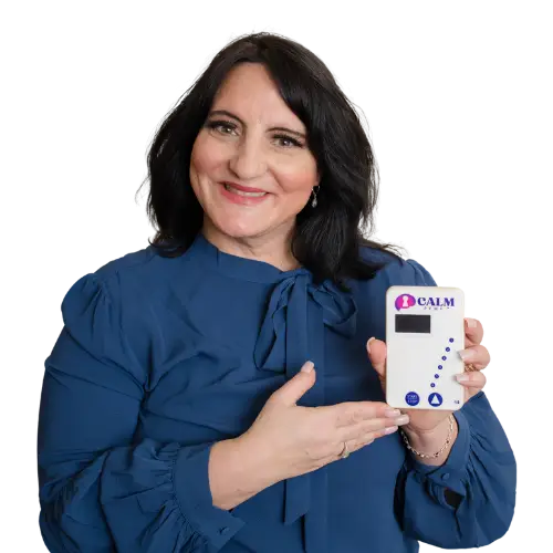 Dr. Roseann Capanna-Hodge holding CALM PEMF device