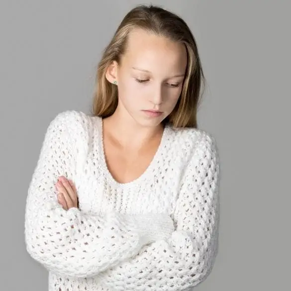 Child showing distressed or withdrawn expression